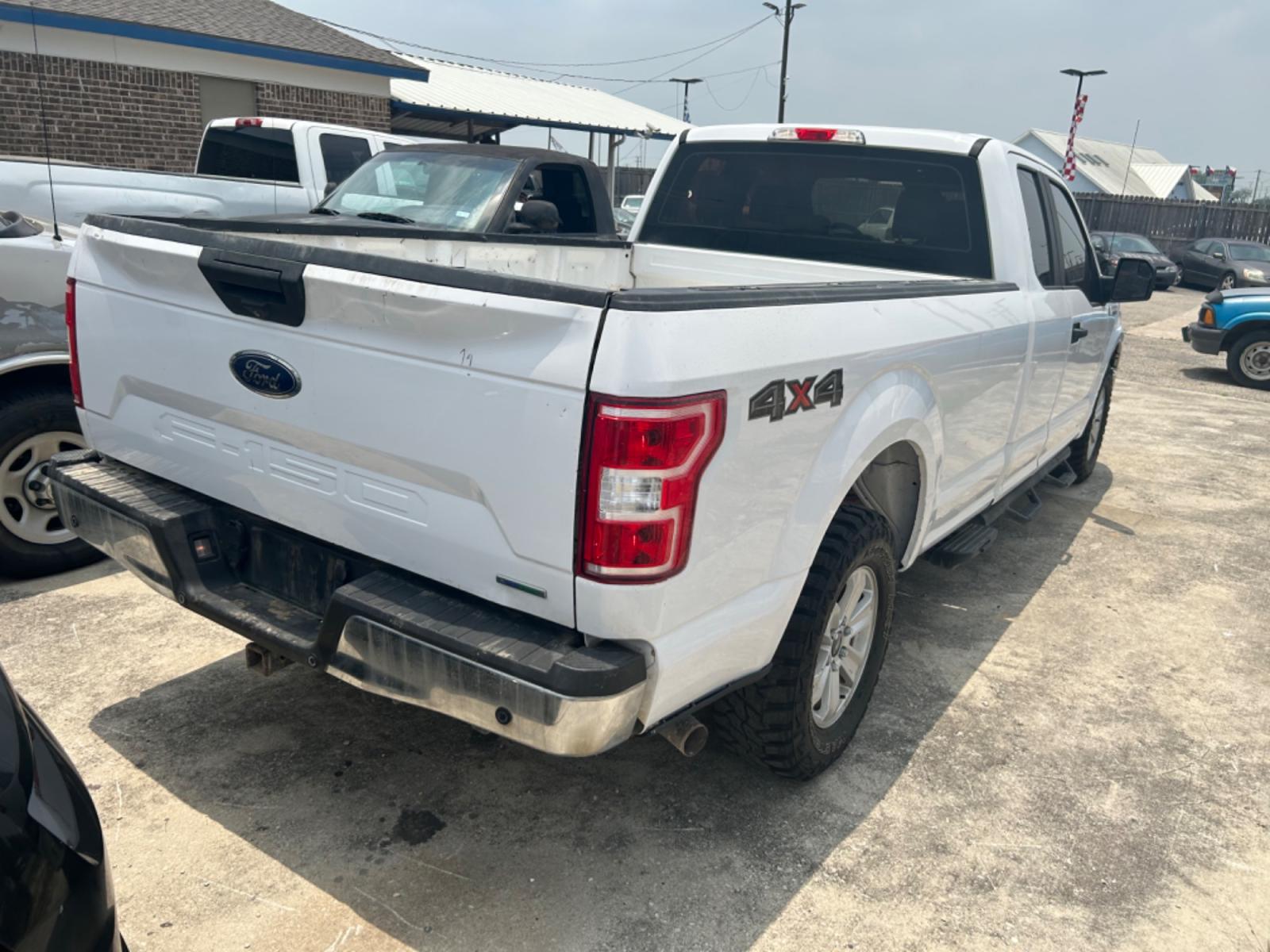 2018 White Ford F-150 XL SuperCab 6.5-ft. 4WD (1FTFX1EG6JK) with an 3.5L V6 DOHC 24V engine, 6A transmission, located at 1687 Business 35 S, New Braunfels, TX, 78130, (830) 625-7159, 29.655487, -98.051491 - Photo #2